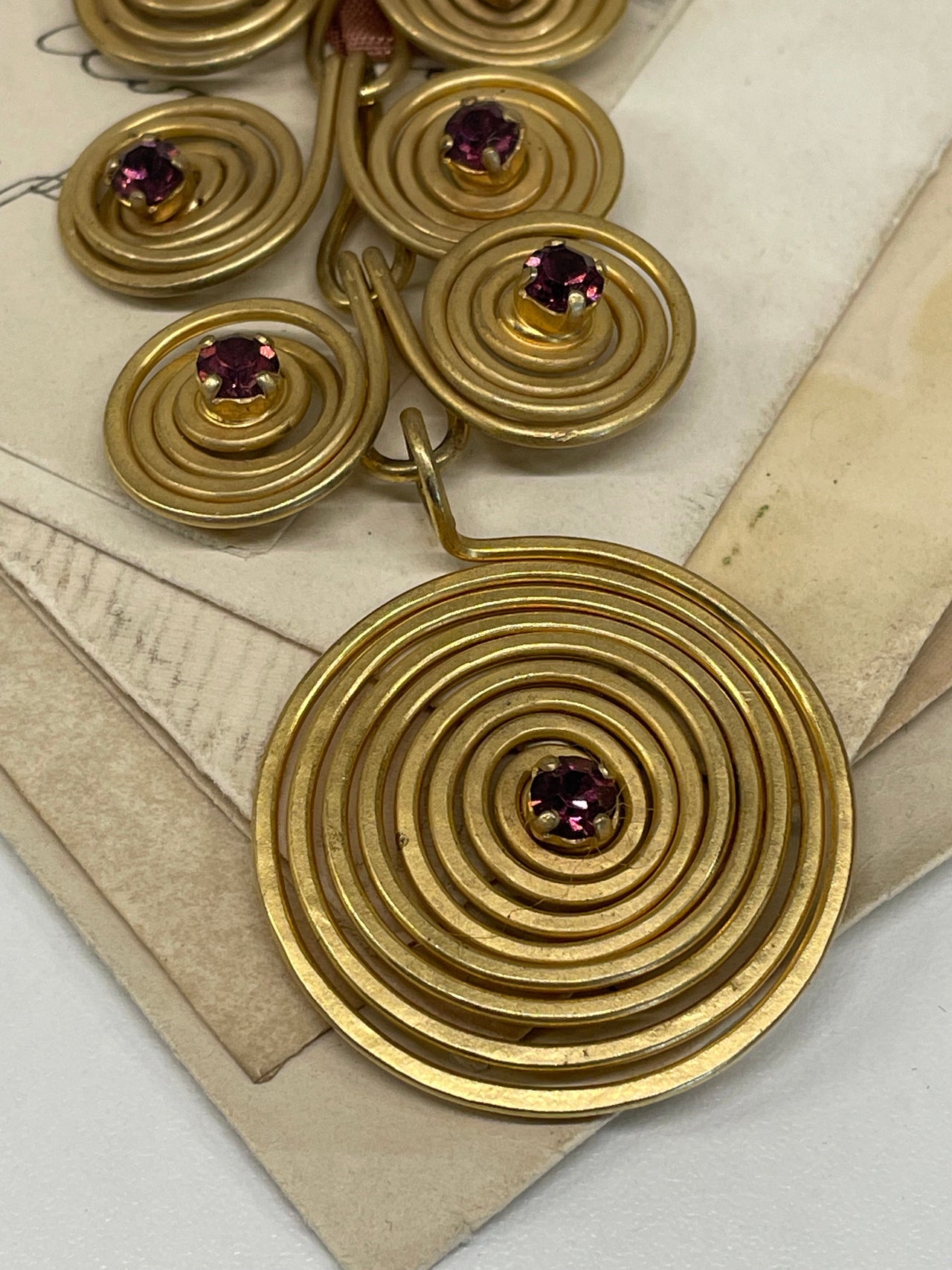 1970’s Matte Gold Spiral Brooch with Purple Rhinestones Devil's Details 