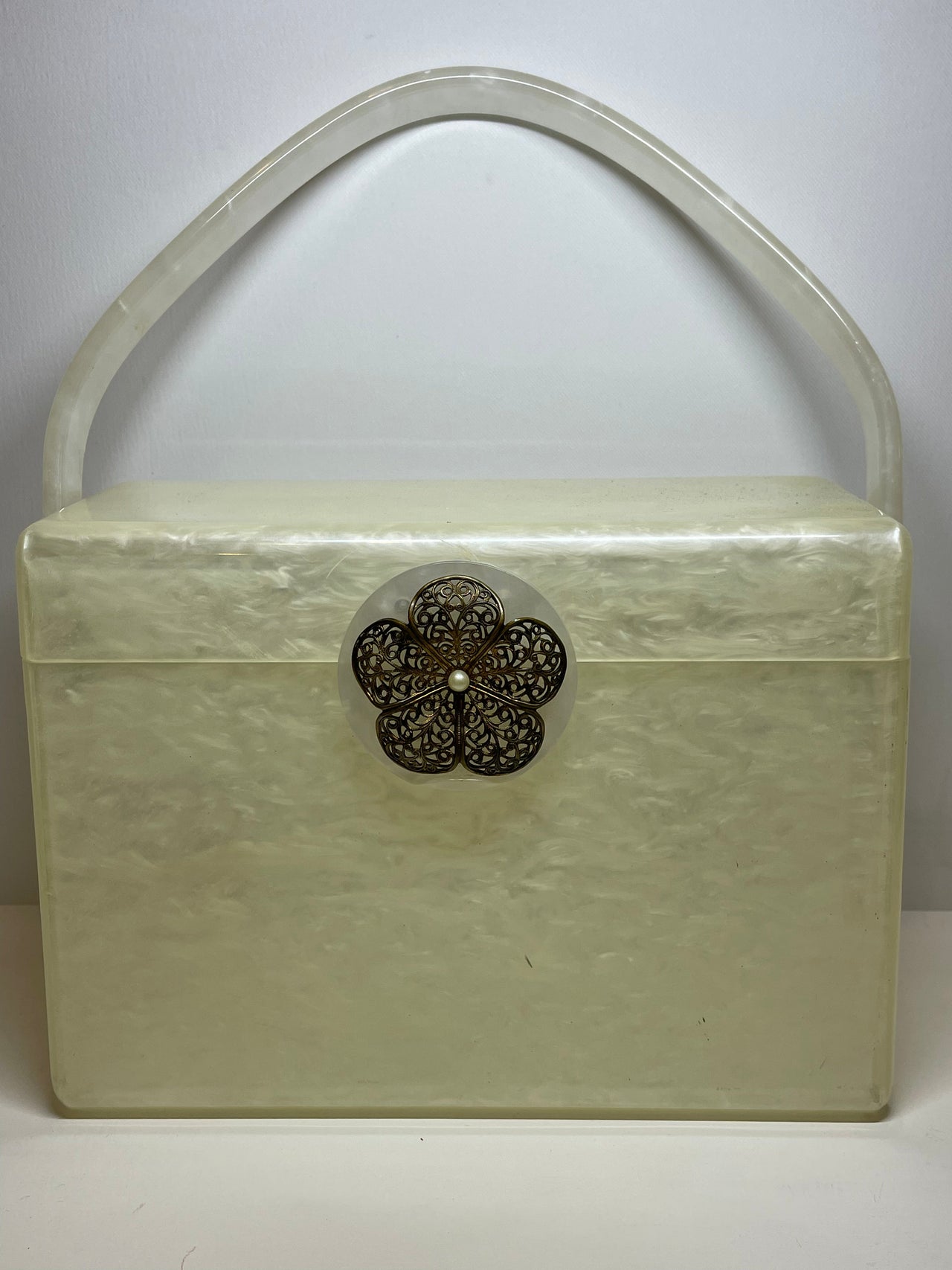 Rebekka needs to give $$Wilardy White Lucite Box Purse Bloomers and Frocks 
