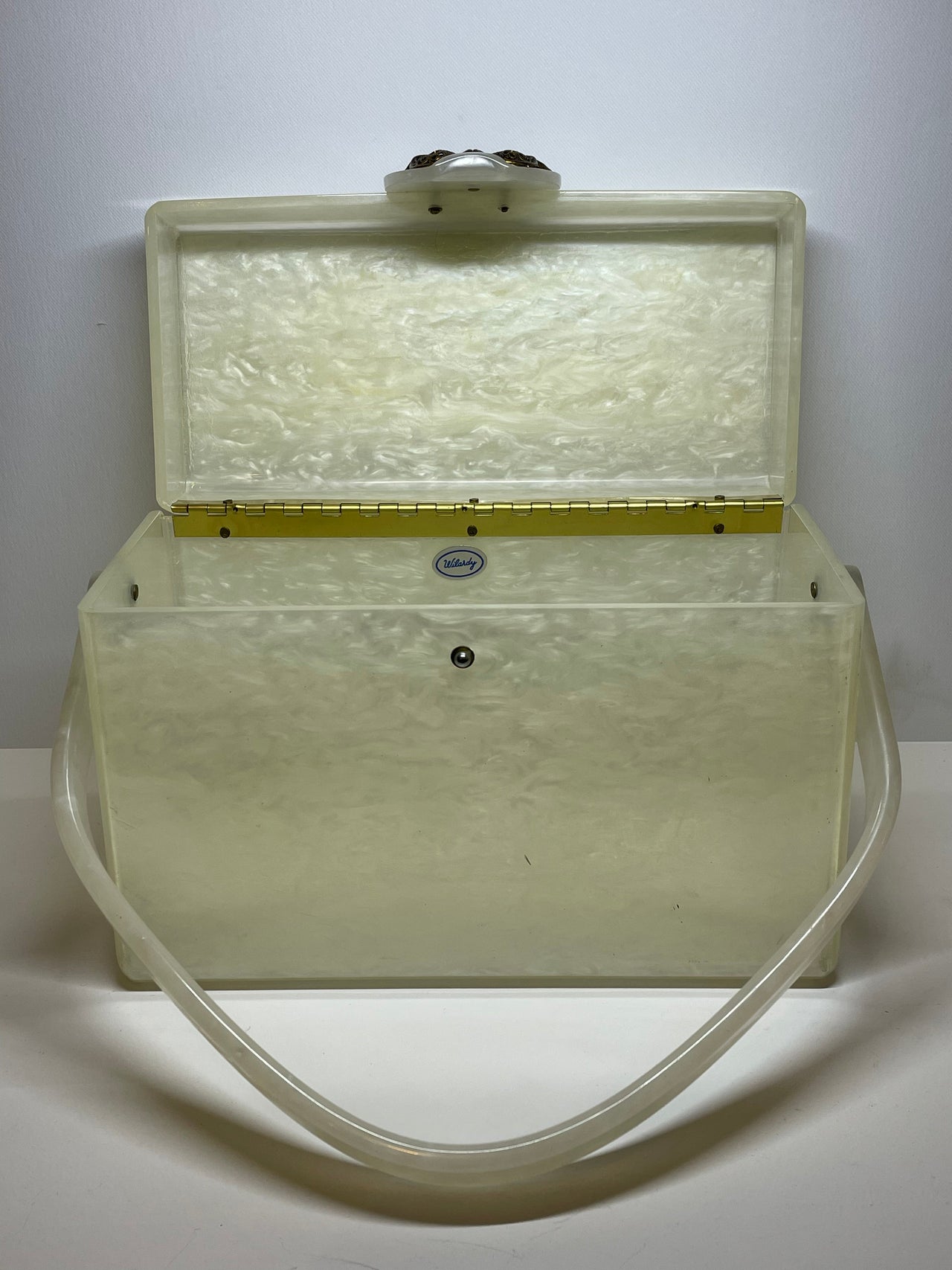Rebekka needs to give $$Wilardy White Lucite Box Purse Bloomers and Frocks 