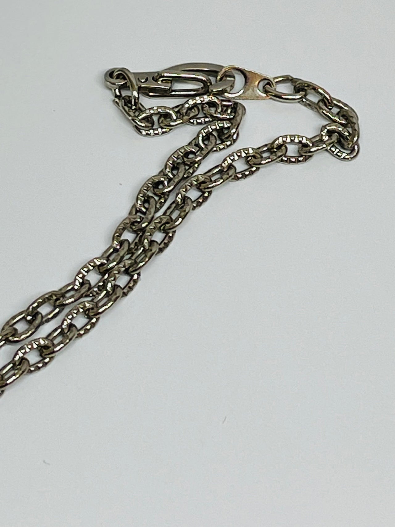 Silver Necklace with a Dark Green Stone Devil's Details 